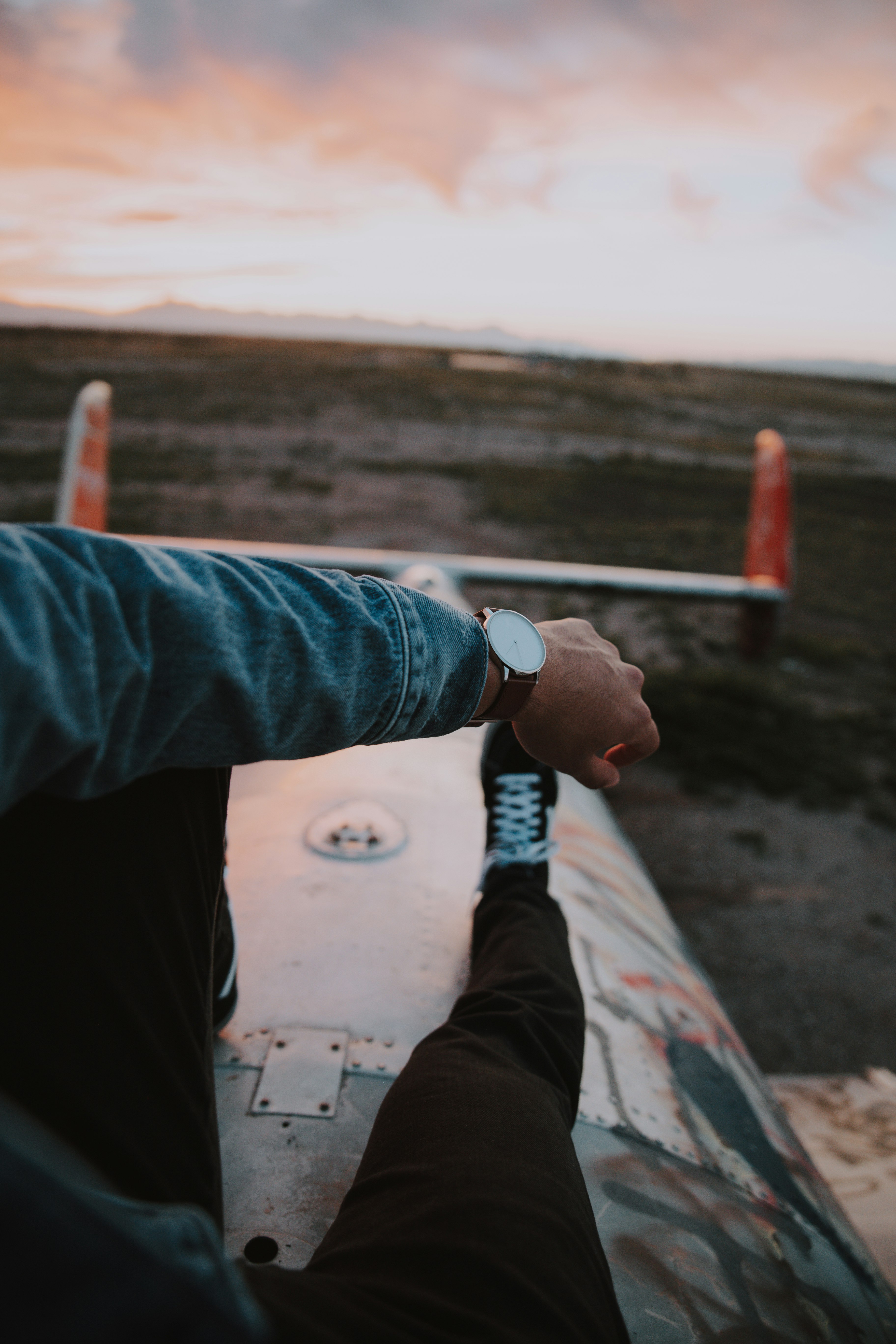 man sitting on metal platform